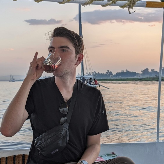 Me drinking tea in a boat on the Nile River